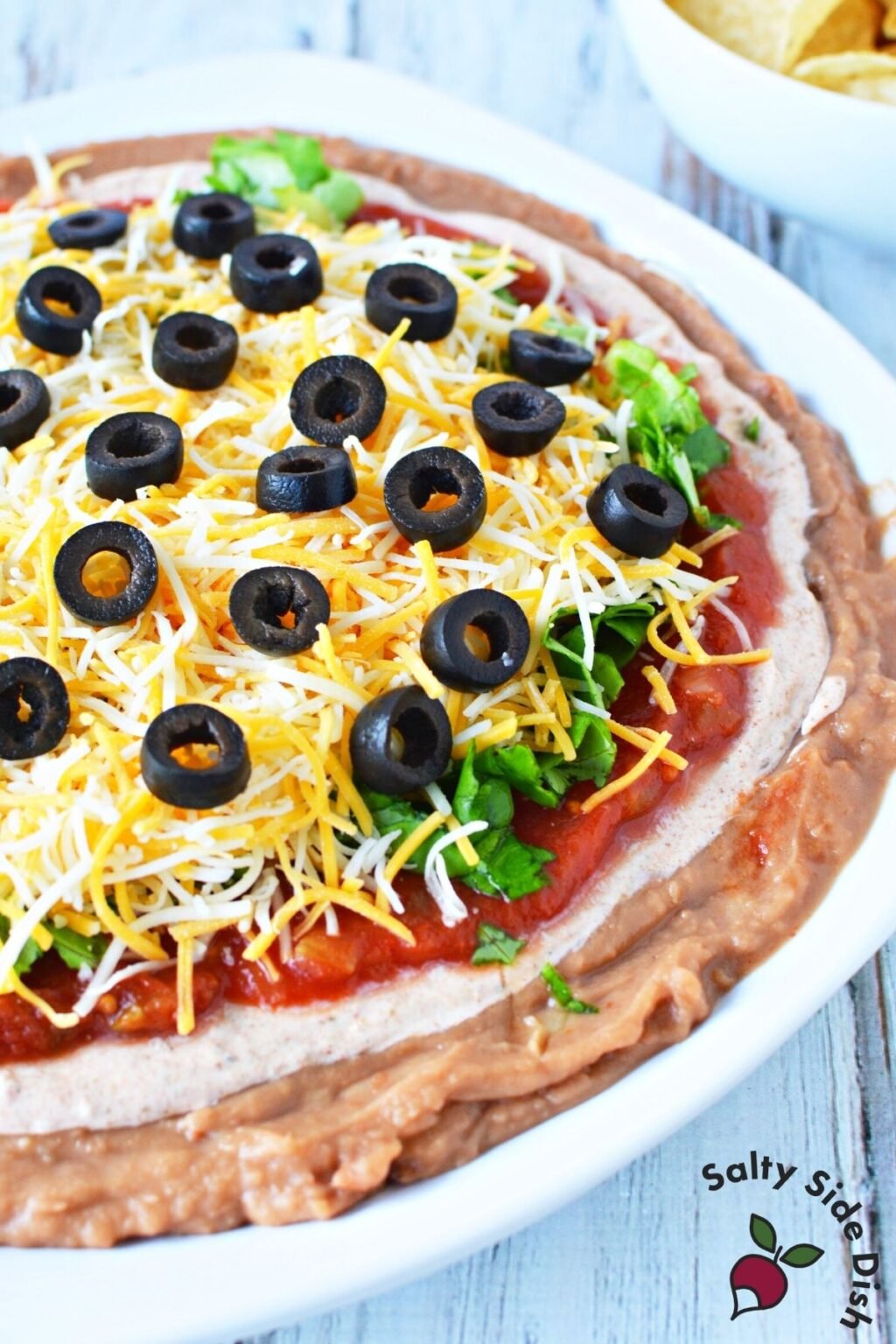 5 Min. Layered Taco Dip with Refried Beans Salty Side Dish