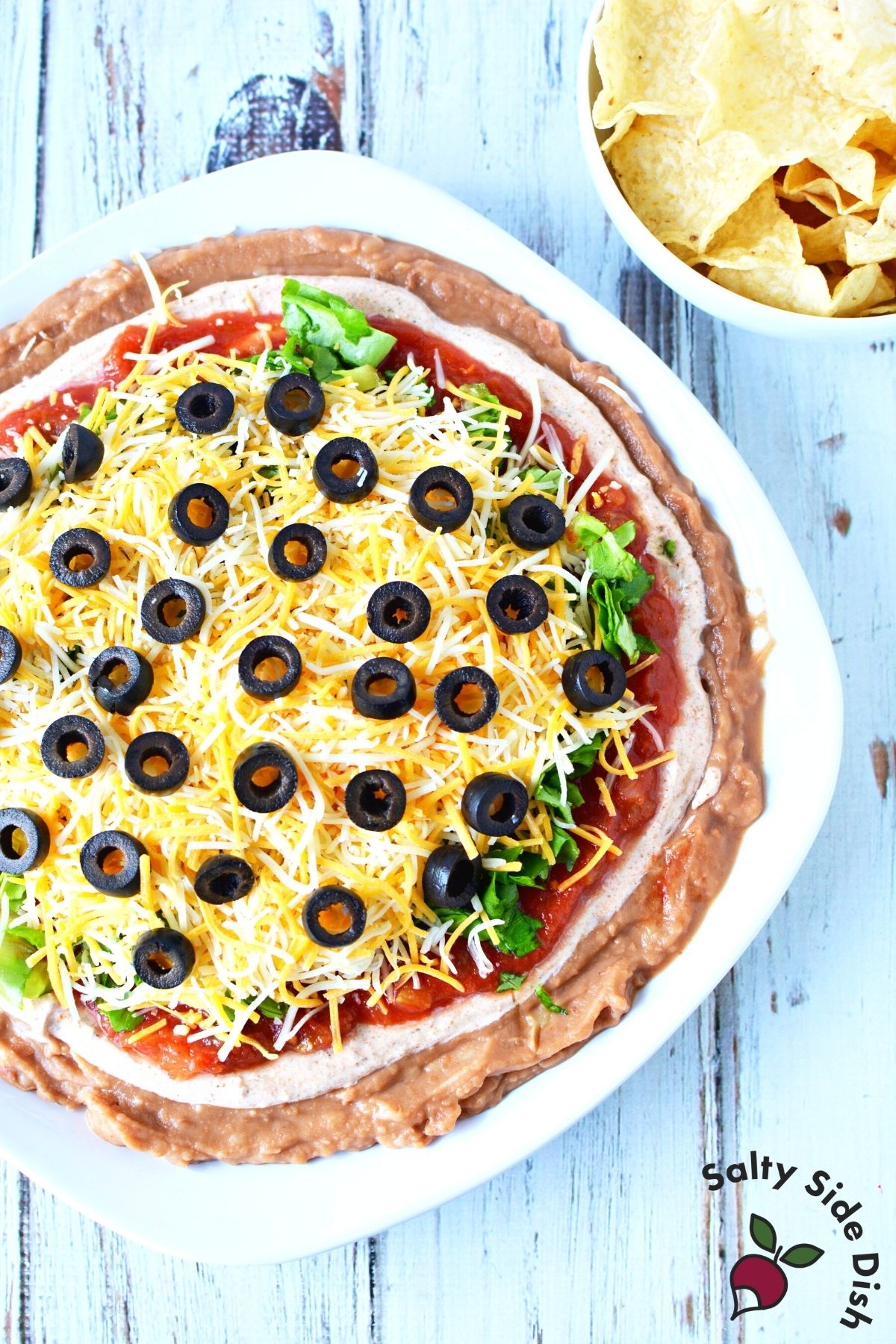 5 Min. Layered Taco Dip with Refried Beans Salty Side Dish