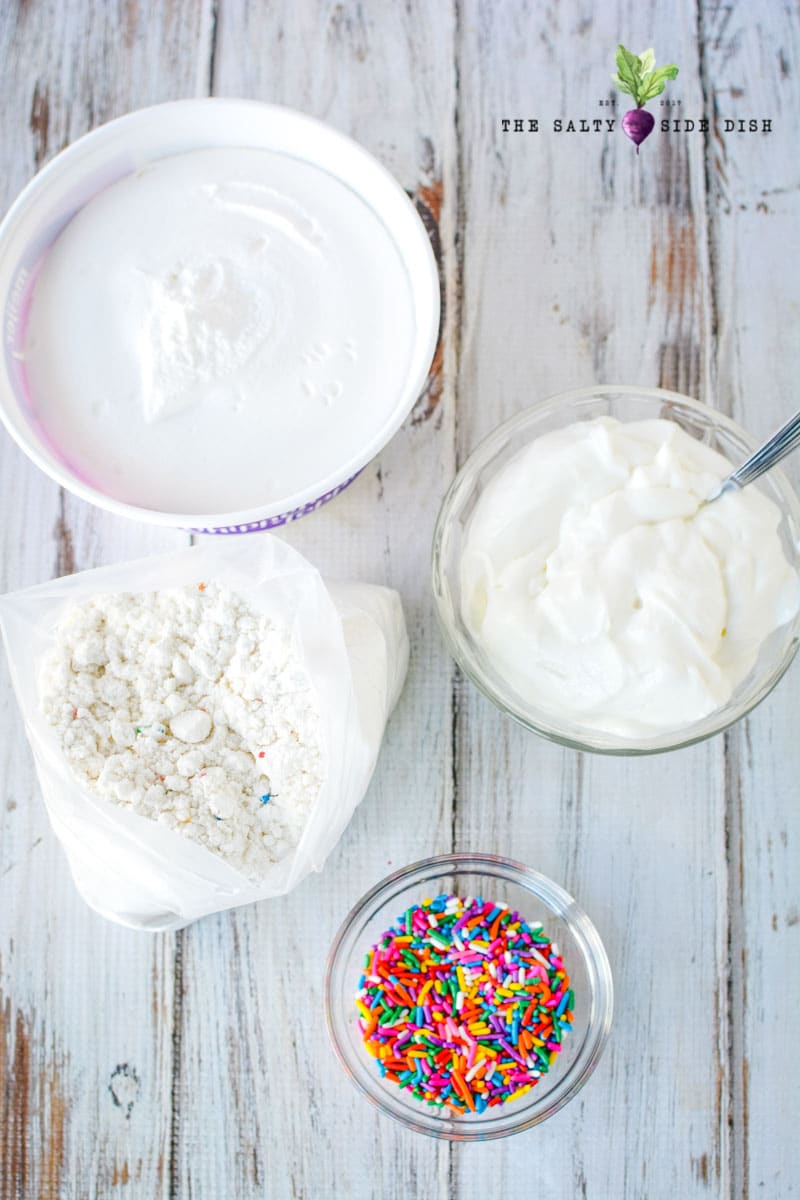 Funfetti Dip Recipe | Funfetti Cake Dip is a super fun, super delicious cake batter dessert dip waiting to be dunked with graham crackers or Nilla Wafers. Layers on the sprinkles and let's get Dipping! #dip #dessertdip #dessert #appetizer #party #parties #dips cake batter dip 4 ingredient recipe is so simple to make as a no bake dessert dip