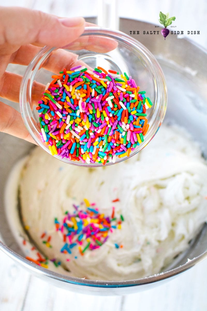 Funfetti Dip Recipe | Funfetti Cake Dip is a super fun, super delicious cake batter dessert dip waiting to be dunked with graham crackers or Nilla Wafers. Layers on the sprinkles and let's get Dipping! #dip #dessertdip #dessert #appetizer #party #parties #dips sprinkles or jimmies go well in this dessert dip