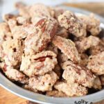 homemade cinnamon sugared candied pecans in a bowl.
