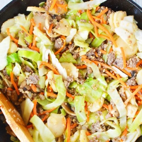 cast iron pan with cooked egg roll in a bowl.