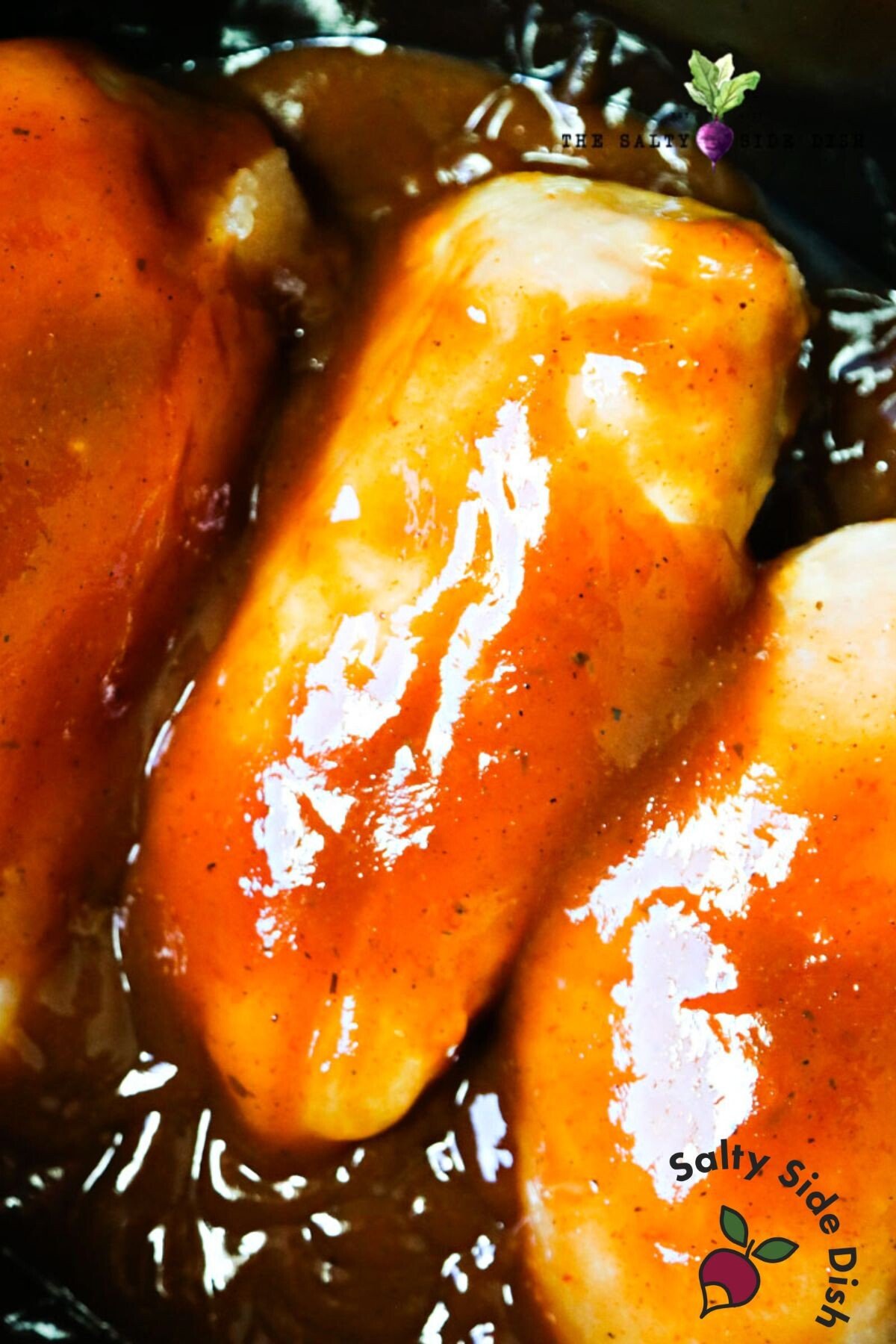 pieces of chicken smothered in bottle BBQ sauce.