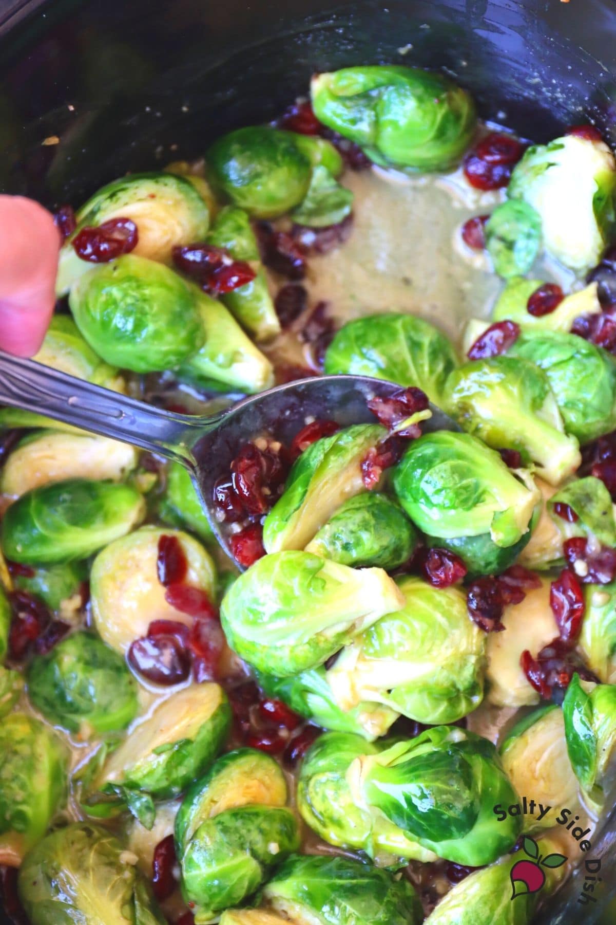 spoon in crock pot brussels sprouts