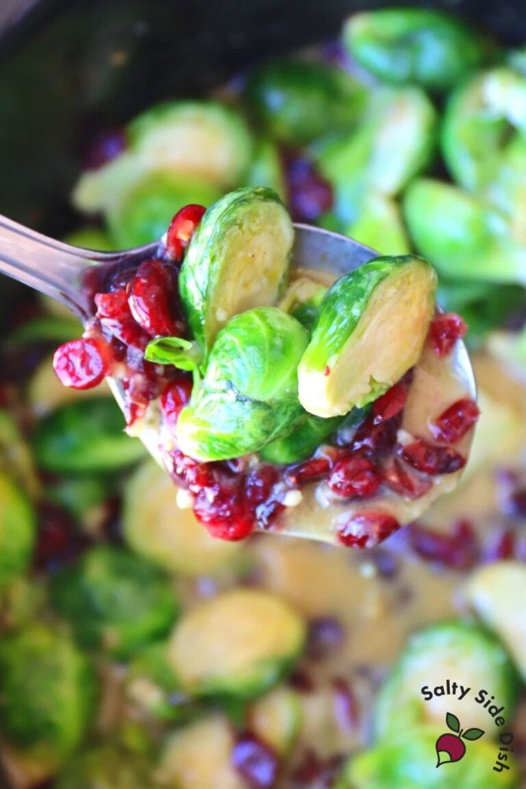spoon of honey dijon slow cooked brussels sprouts with cranberries