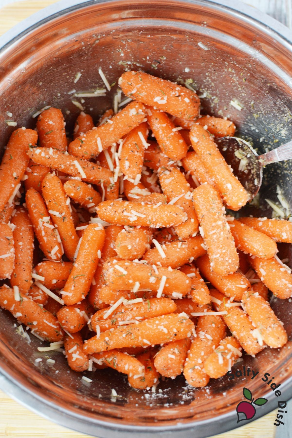 baby carrots tossed with parmesan cheese and garlic seasoning before roasting