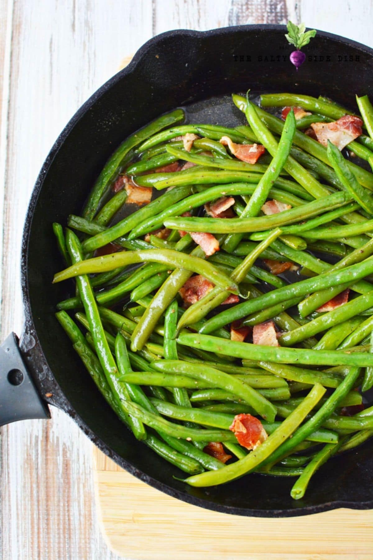 cooking fresh green beans in a cast iron pan