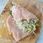 stuffing full asparagus and cheese inside a chicken breast.