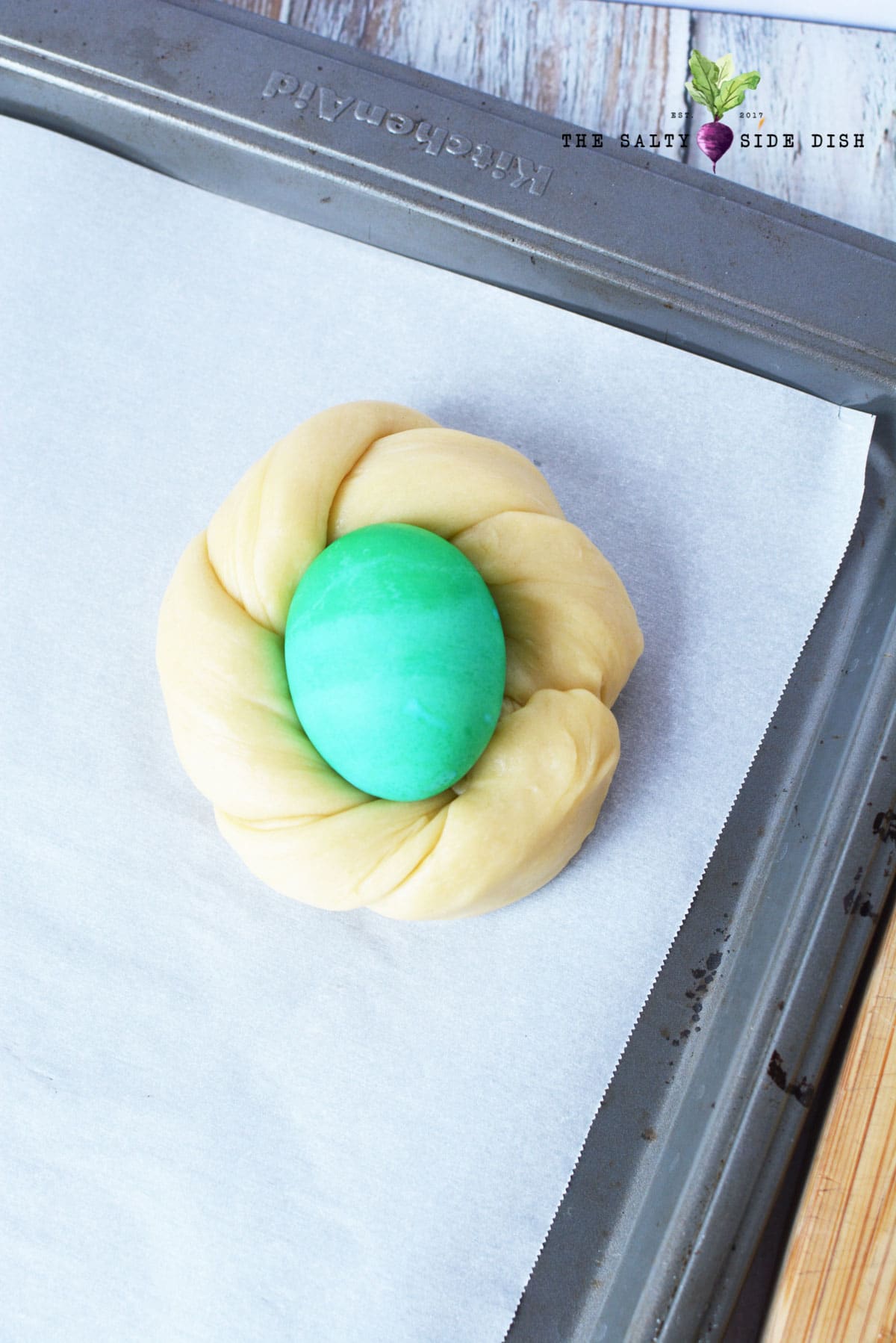 twist dough into nest and add raw egg