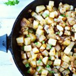 easy cowboy potatoes in a cast iron skillet.