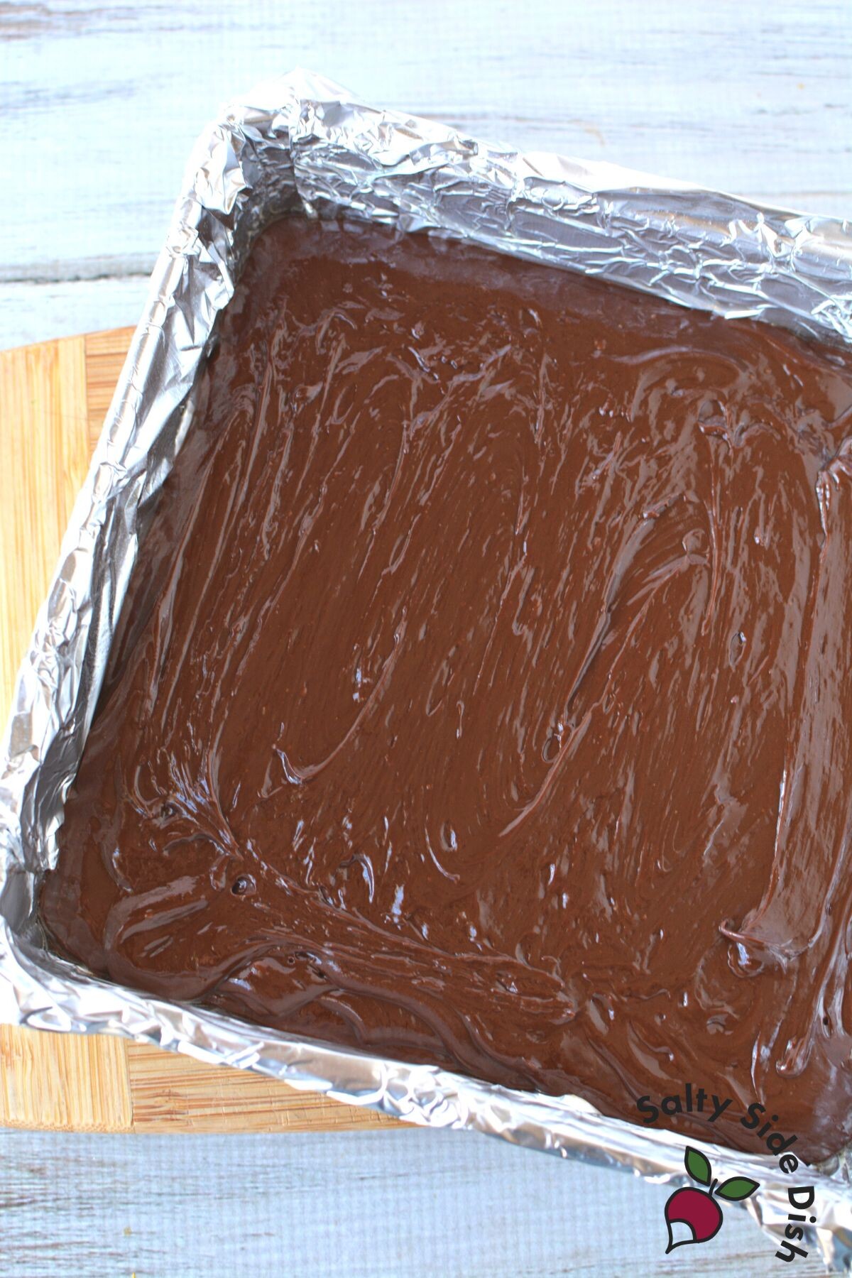 fudge in a baking pan with foil.
