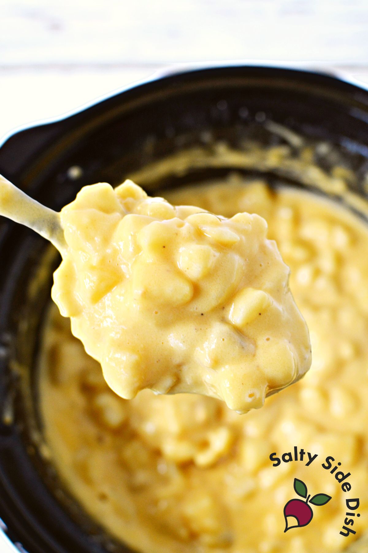 large spoonful of cheesy potatoes.
