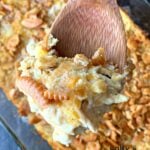 spoon stirring ritz cracker chicken casserole
