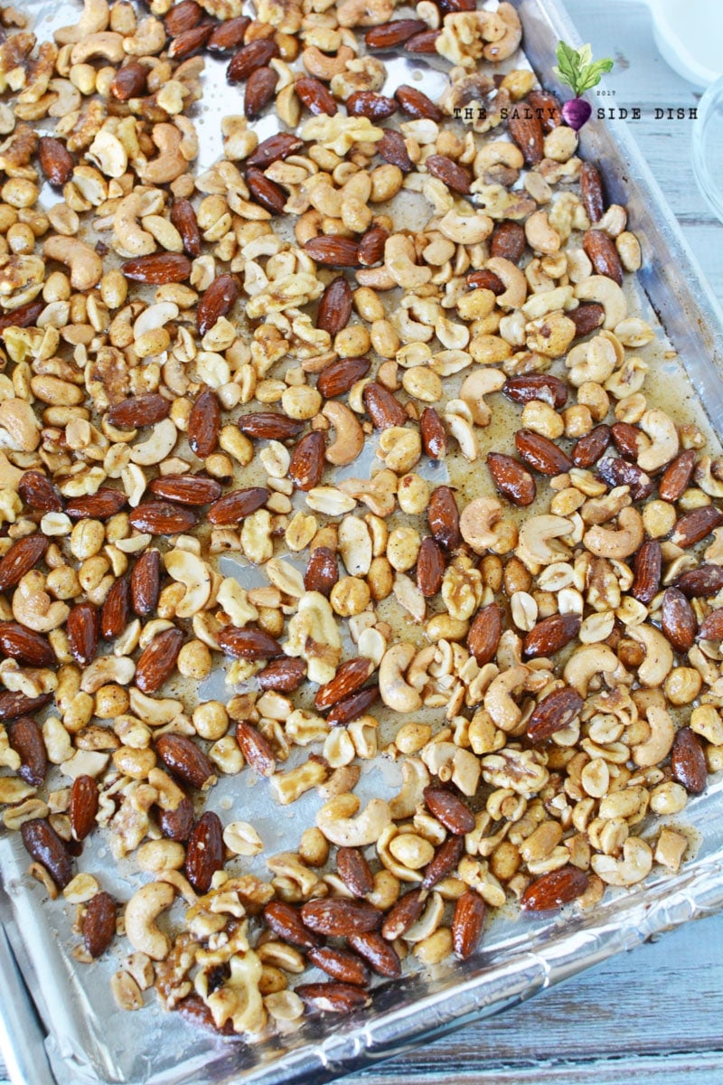 spiced nut mixture laying on a sheet pan