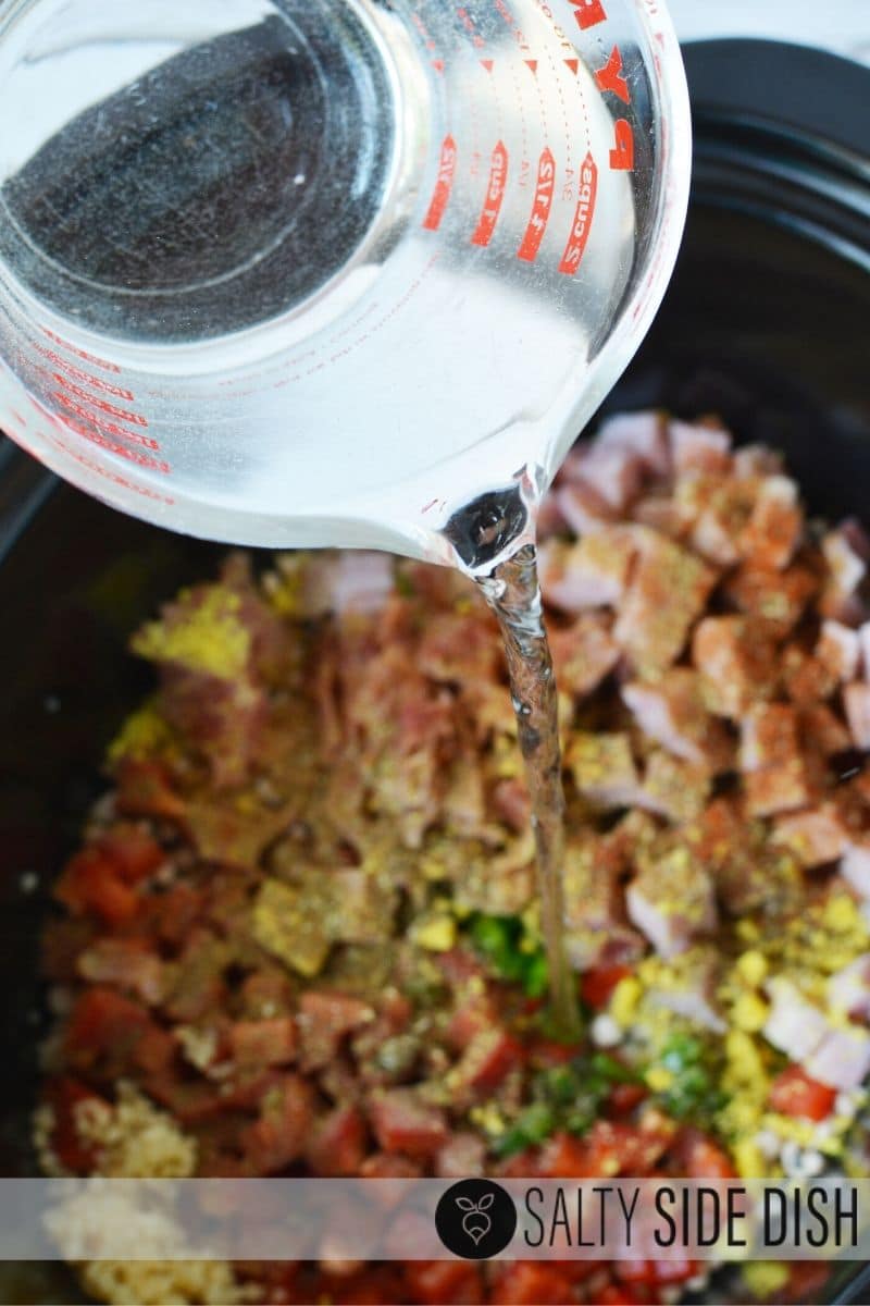Slow Cooker Black Eyed Peas | Easy black eyed peas is a perfect deep South recipe and goes great with greens, cornbread or over rice. Delicious! #sidedish #blackeyedpeas #southern #menu #recipe #sides #beans #slowcooker pouring water in slow cooker for black eyed peas recipe