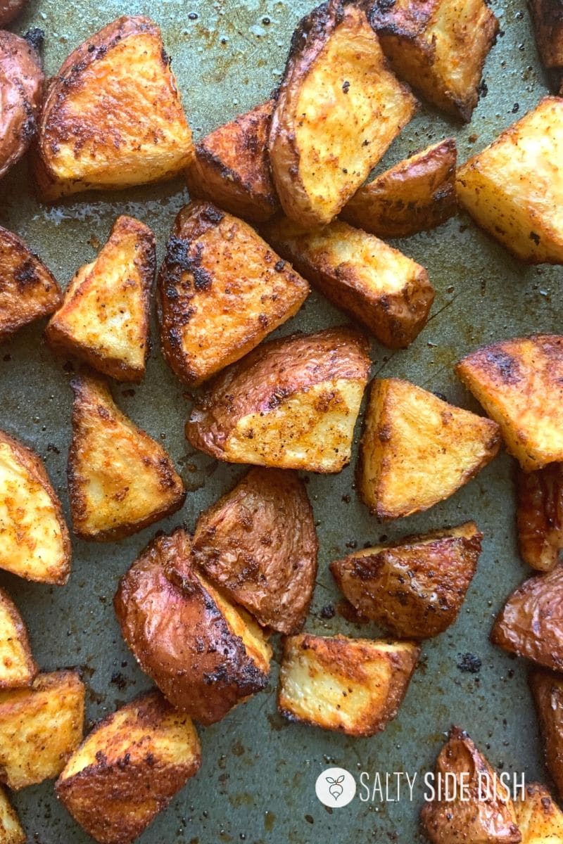 Roasted Breakfast Potatoes on oven sheet already baked and crispy