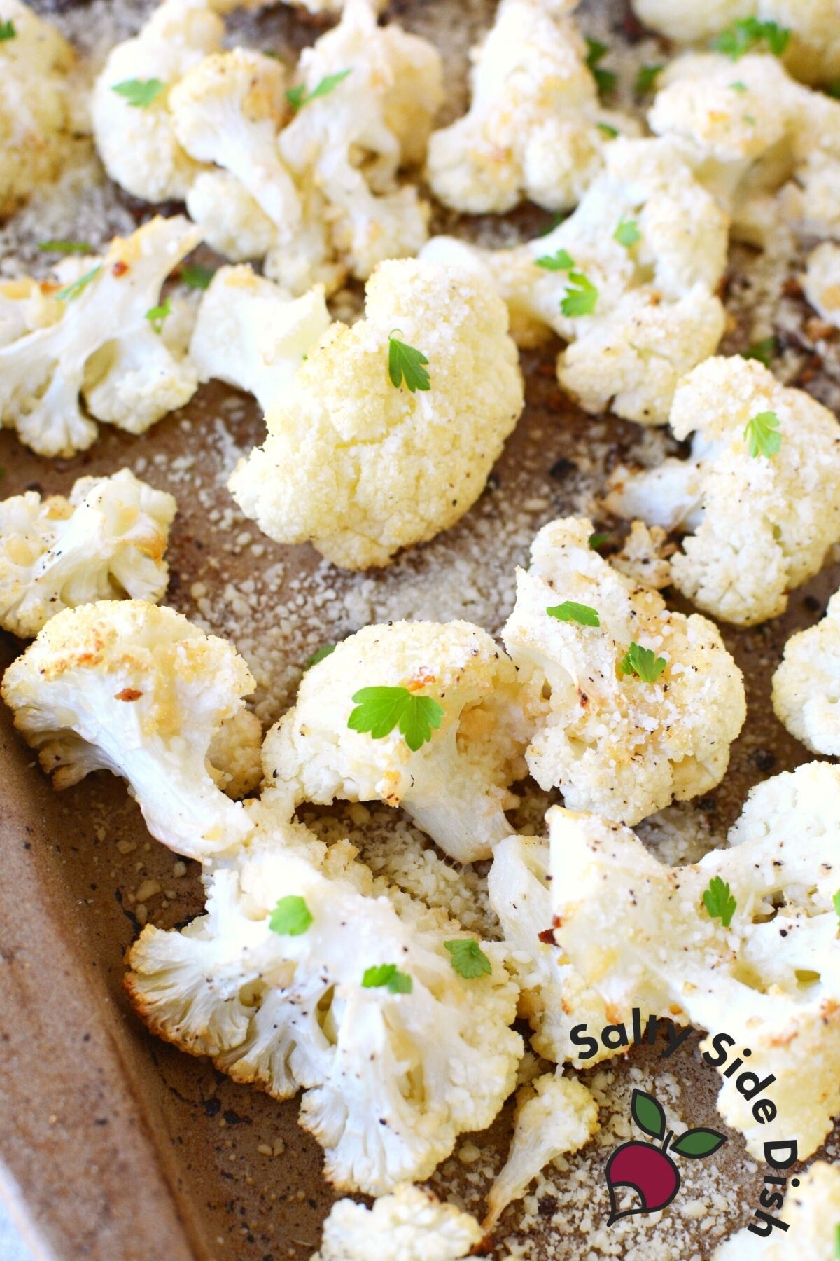 parmesan garlic roasted cauliflower on a sheet pan.
