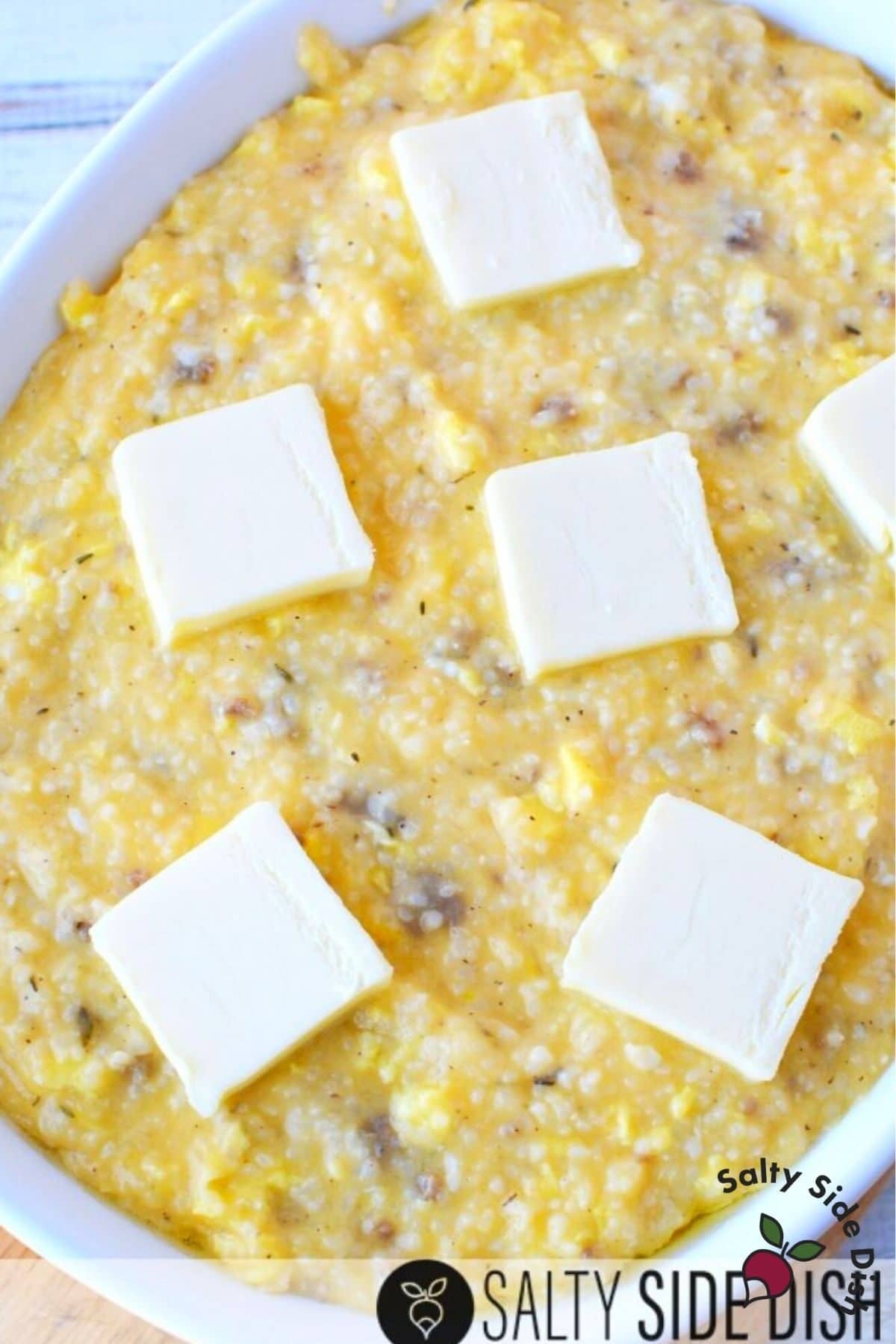 sausage grits and butter in a casserole dish