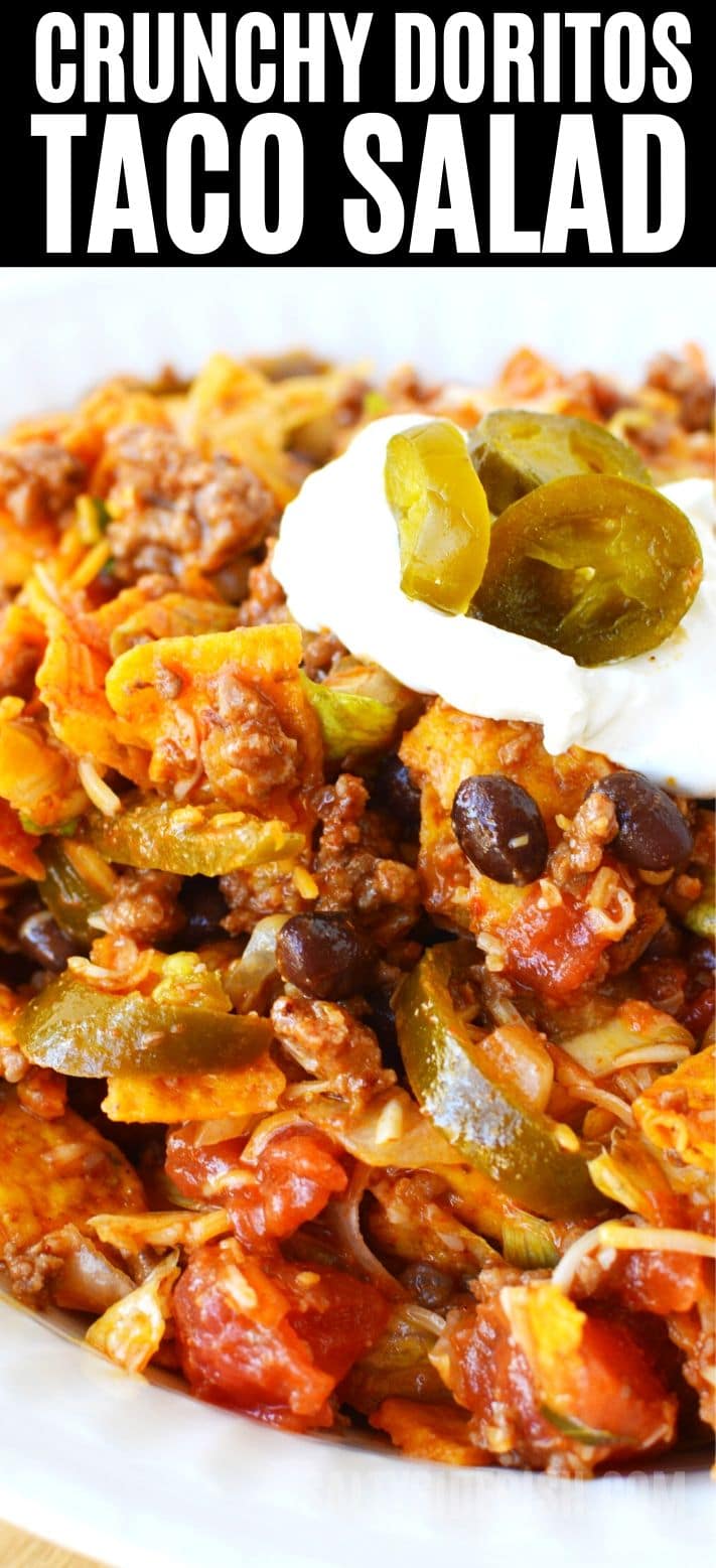Dorito taco salad | seasoned taco beef, shredded cheese, sliced jalapenos with homemade taco salad dressing - Perfect for Potlucks and Picnics #potluck #recipe #sidedish #salad #tacosalad #doritos #doritotacosalad #sides dorito taco salad