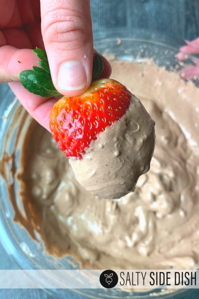 Brownie Batter Dip Appetizer Recipe, a sweet dessert dip to pair with strawberries, apples, pretzels, or wafers - delicious chocolate on chocolate with chunks of real brownies and done in 5 minutes #desserts #chocolate #dips #pretzels #recipes Fresh ripe strawberry dipped in brownie batter dip is the perfect delicious valentines day recipe dip