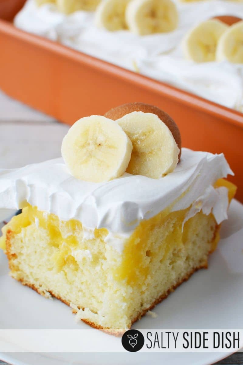 Banana Pudding Poke Cake with sweet pudding center and whipped cream topping, fresh bananas and nilla wafers finish off this amazing spring poke cake #pokecake #bananapokecake #pokecakes #recipe #dessert #easterrecipes #easterdesserts #bananas Topped layers of whipped topping and banana pudding for a rich delicious poke cake recipe