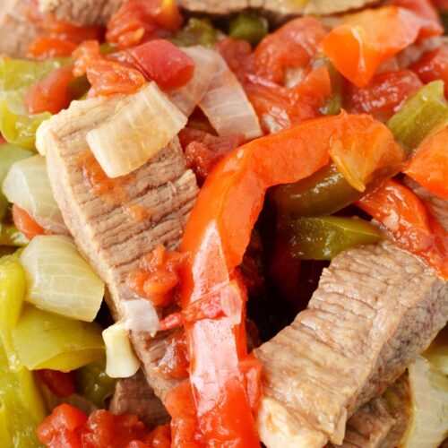 beef and peppers from slow cooker piled on a plate.
