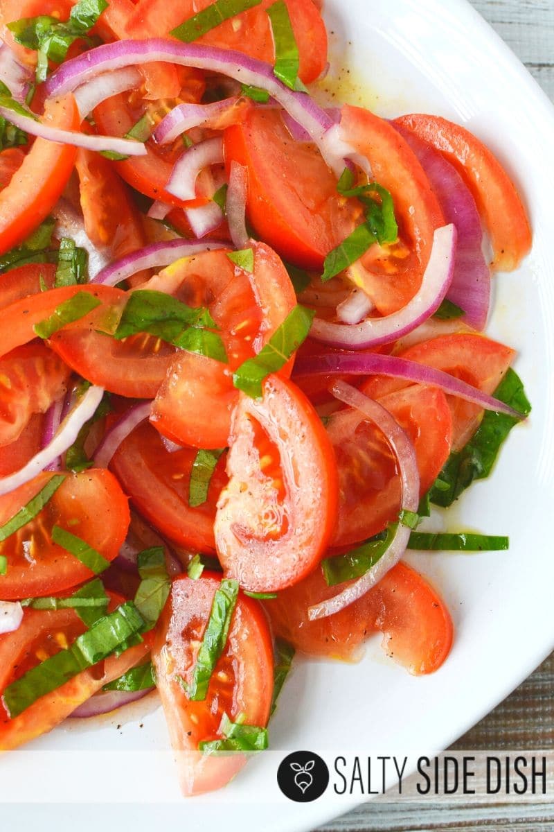 Marinated Tomato Salad with Red Onion Slices, Fresh Basil, and Red Wine Vinegar #tomatosalad #sidesalad #salads #saltysidedish Homemade Marinated Tomato Salad with Slicer Tomatoes and red onions