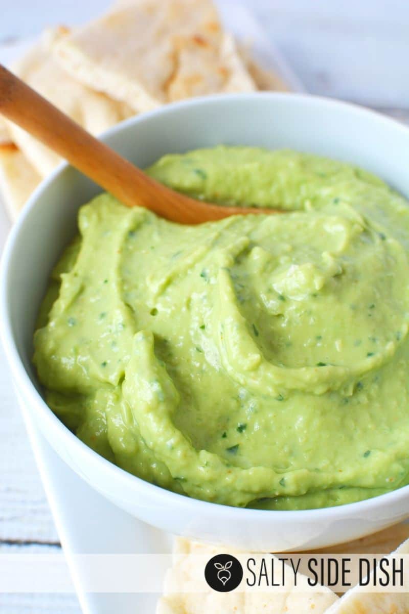 ready to eat avocado tzatziki dip with a bowl and spoon