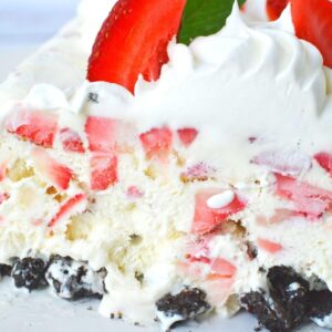 best strawberry and oreo ice box cake sitting on a plate