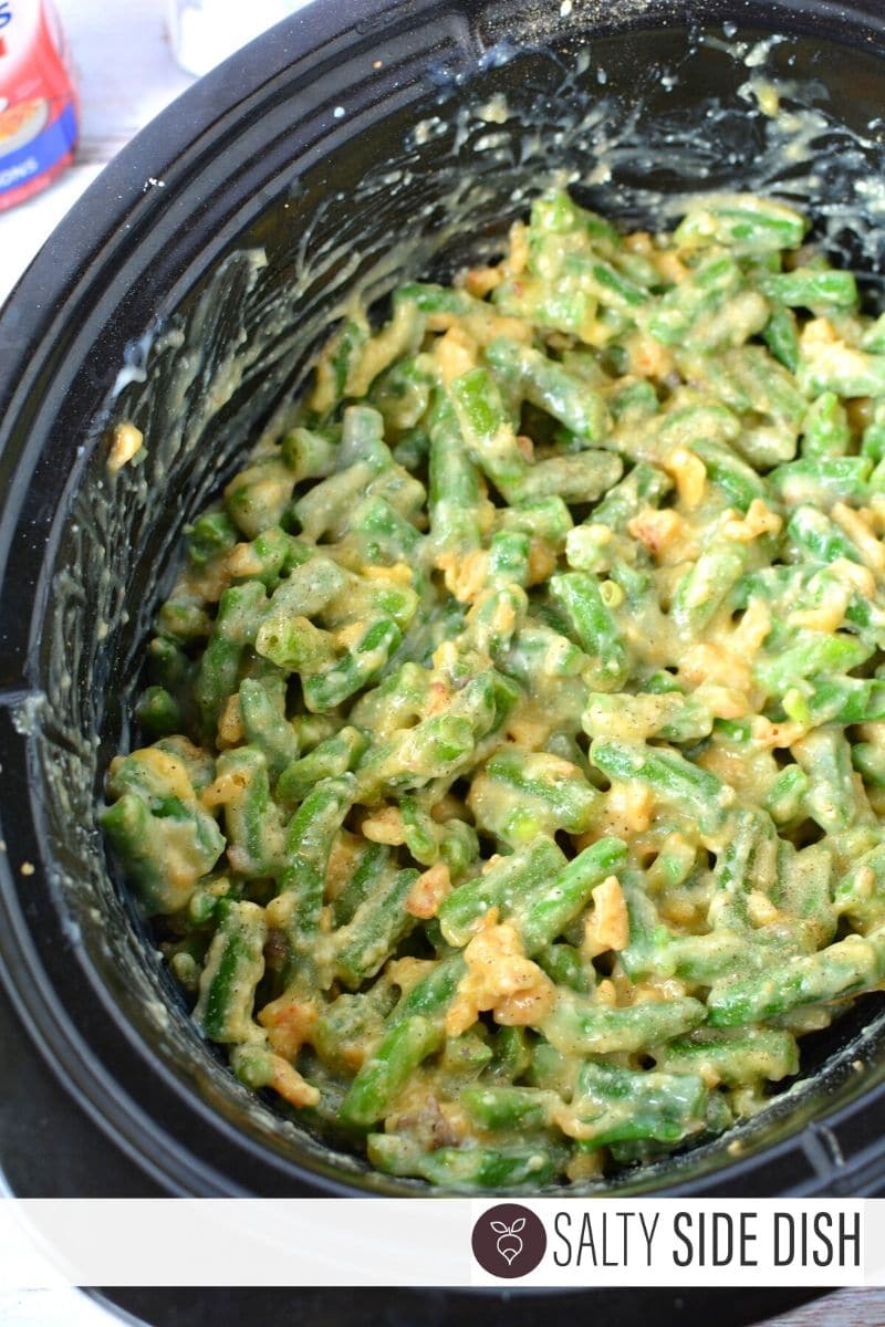 stirred up green beans in a slow cooker
