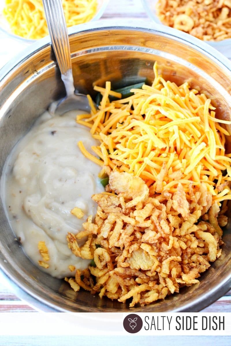 Green bean casserole with cream of mushroom soup add cream of mushroom soup, cheddar cheese, and fried onions to a bowl with your green beans