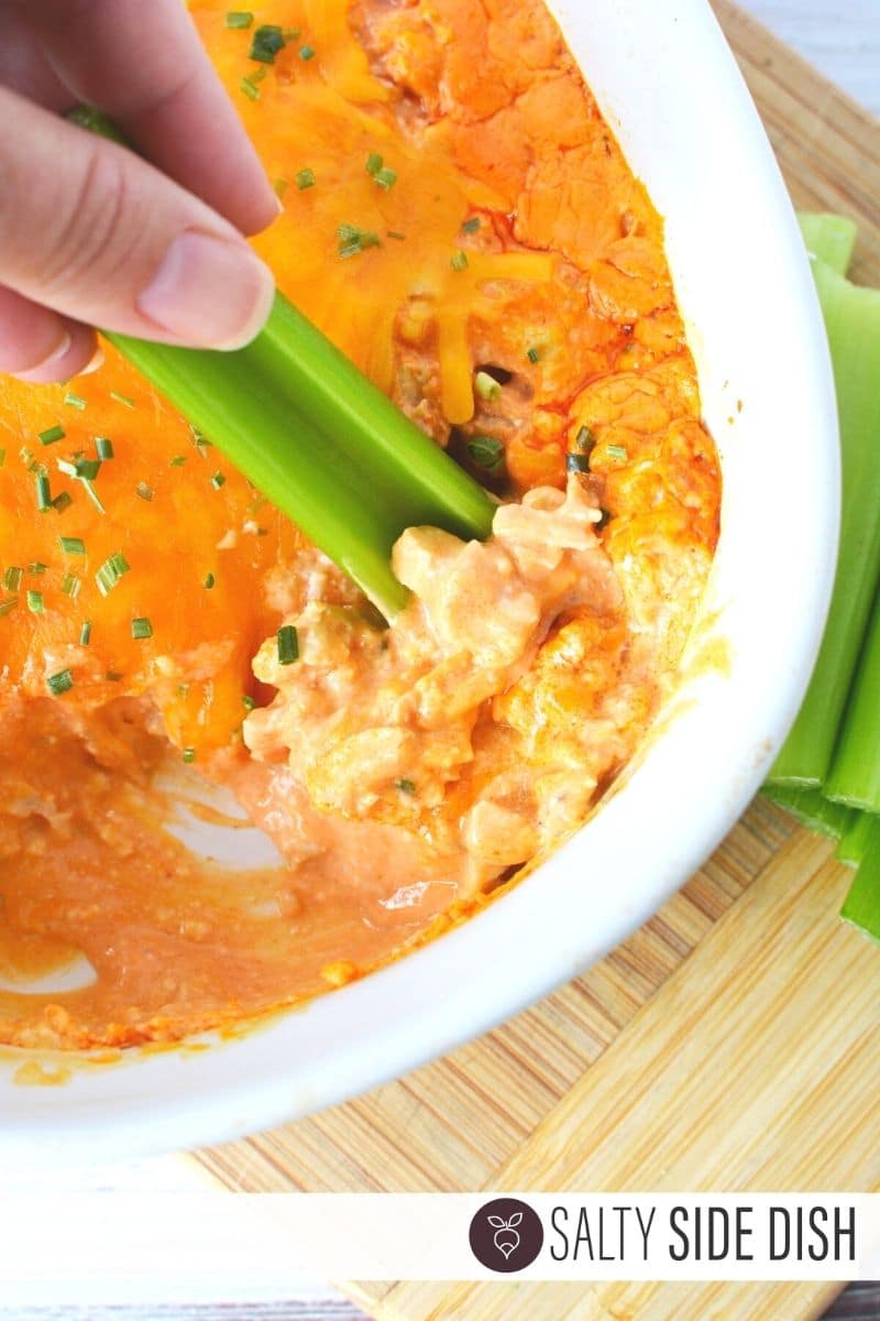 Buffalo Chicken Ranch Dip Buffalo Chicken Ranch Dip being dipped with a celery stalk