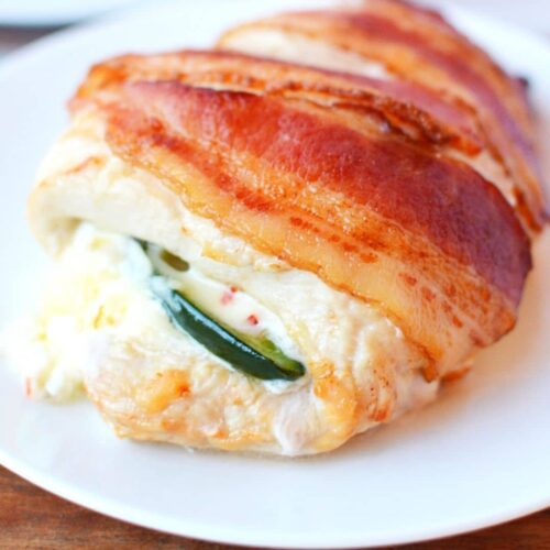 jalapeno chicken in air fryer wrapped with bacon.