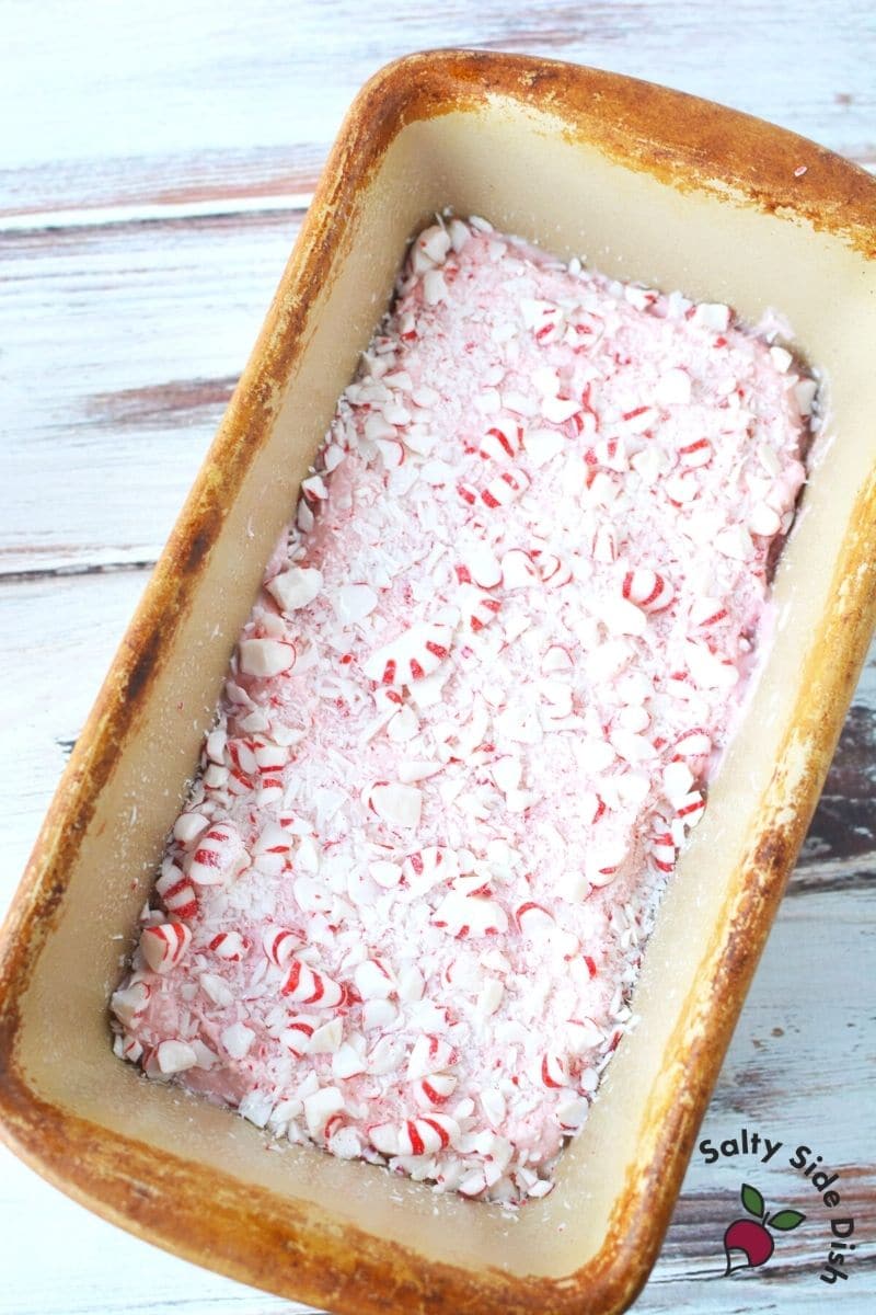 crushed peppermint with bread sitting in loaf pan