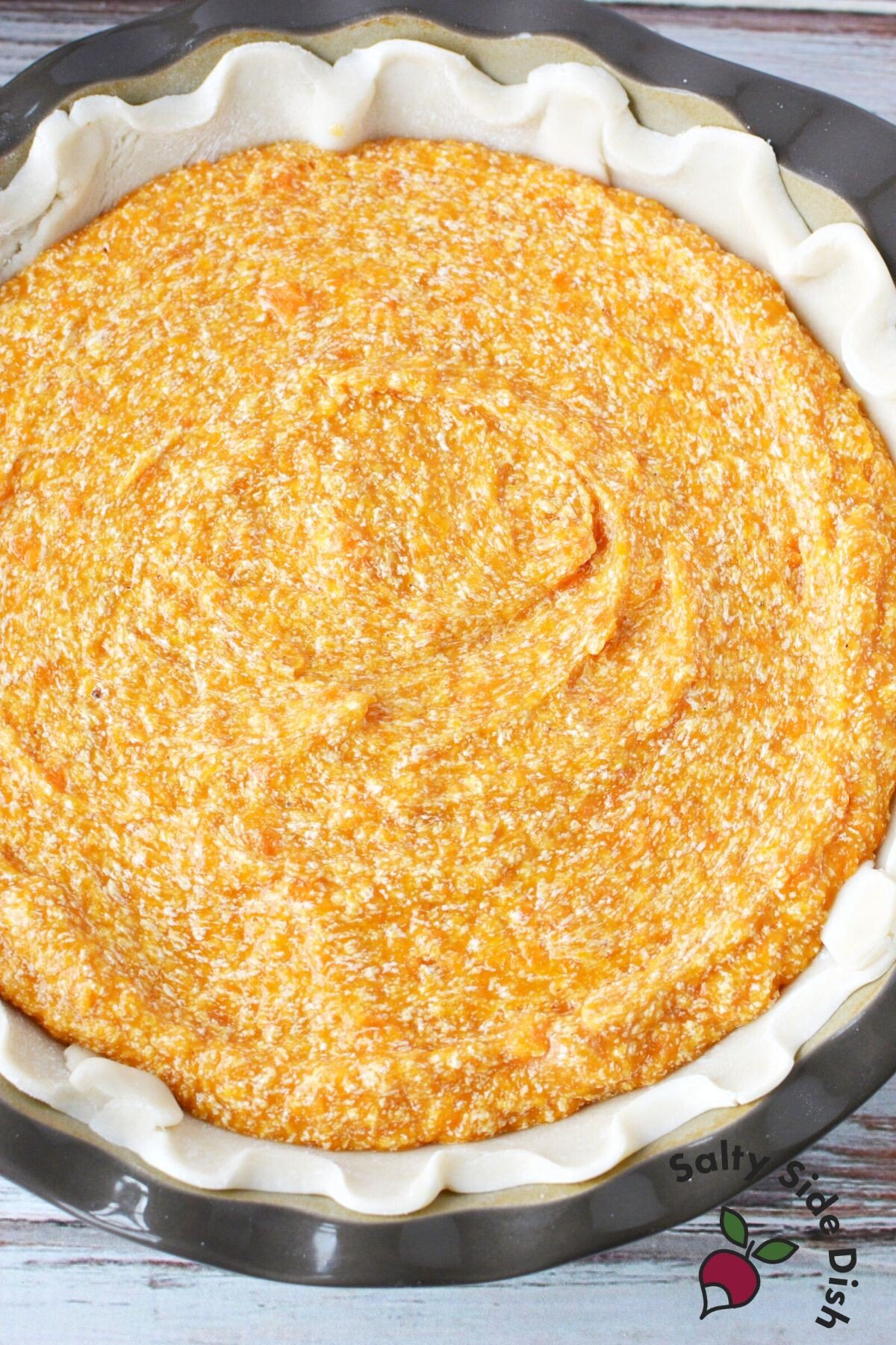 sweet potato pie mixture in pie crust.
