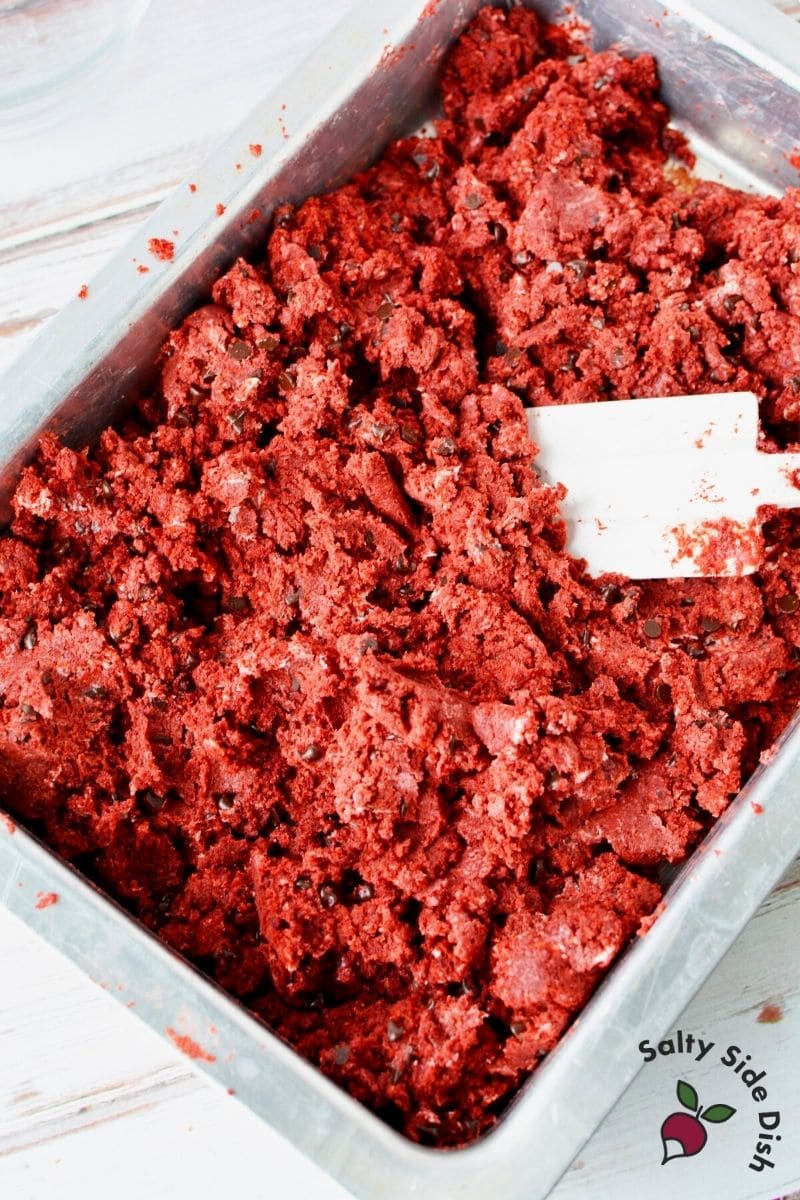 cake ball mixed up with red velvet cake in preparation for cake balls