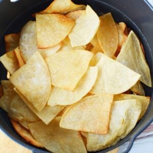 stacked up tortilla chips in air crisp basket