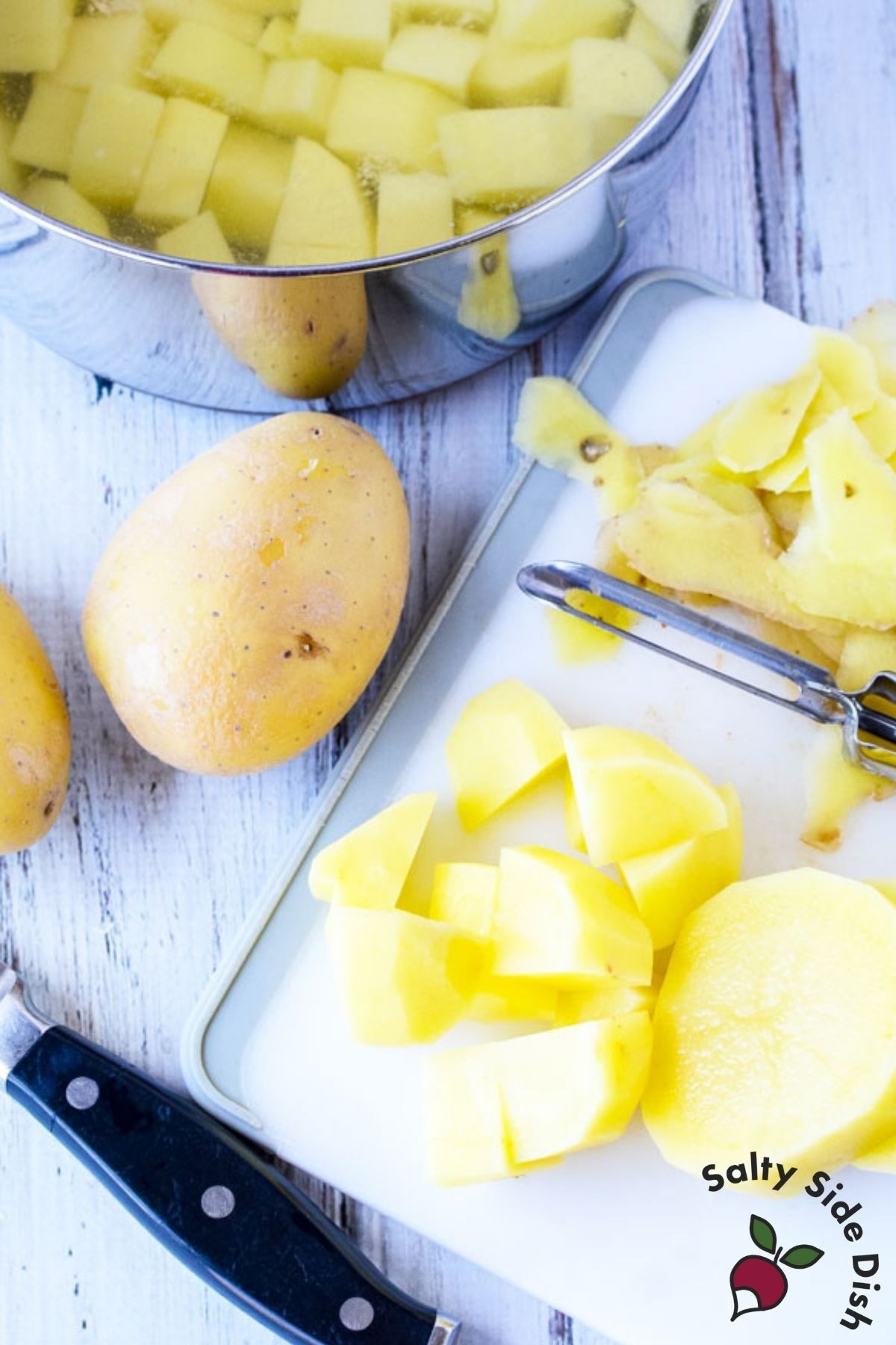 peeling potatoes for potato salad.