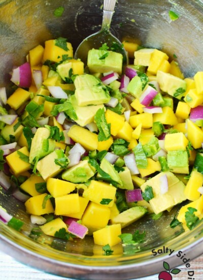 prepping fish salsa into a bowl.