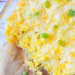 scoops of corn casserole out of dish
