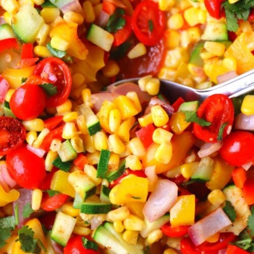 scoop of corn succotash in pot