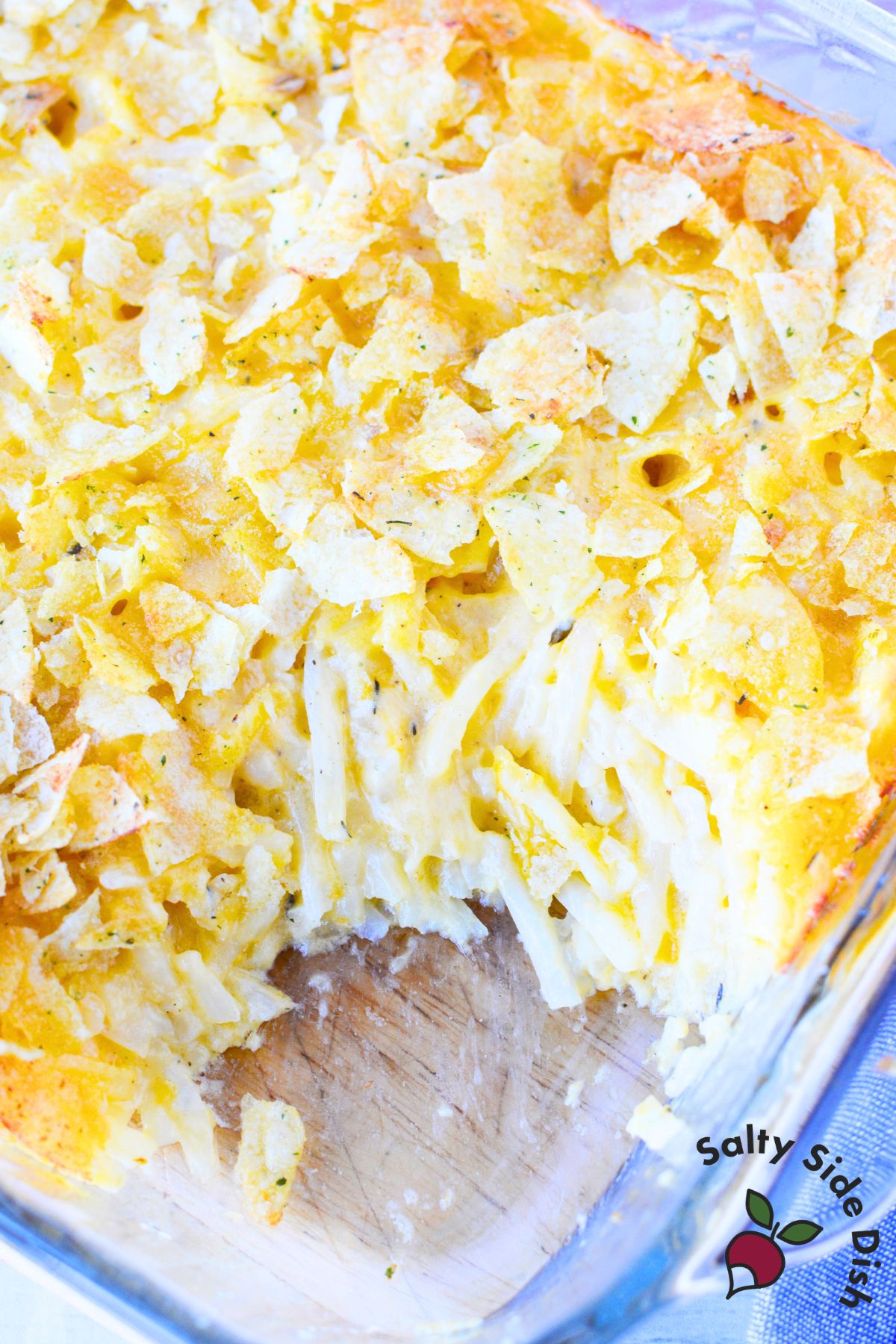Funeral potatoes topped with crushed sour cream and onion potato chips