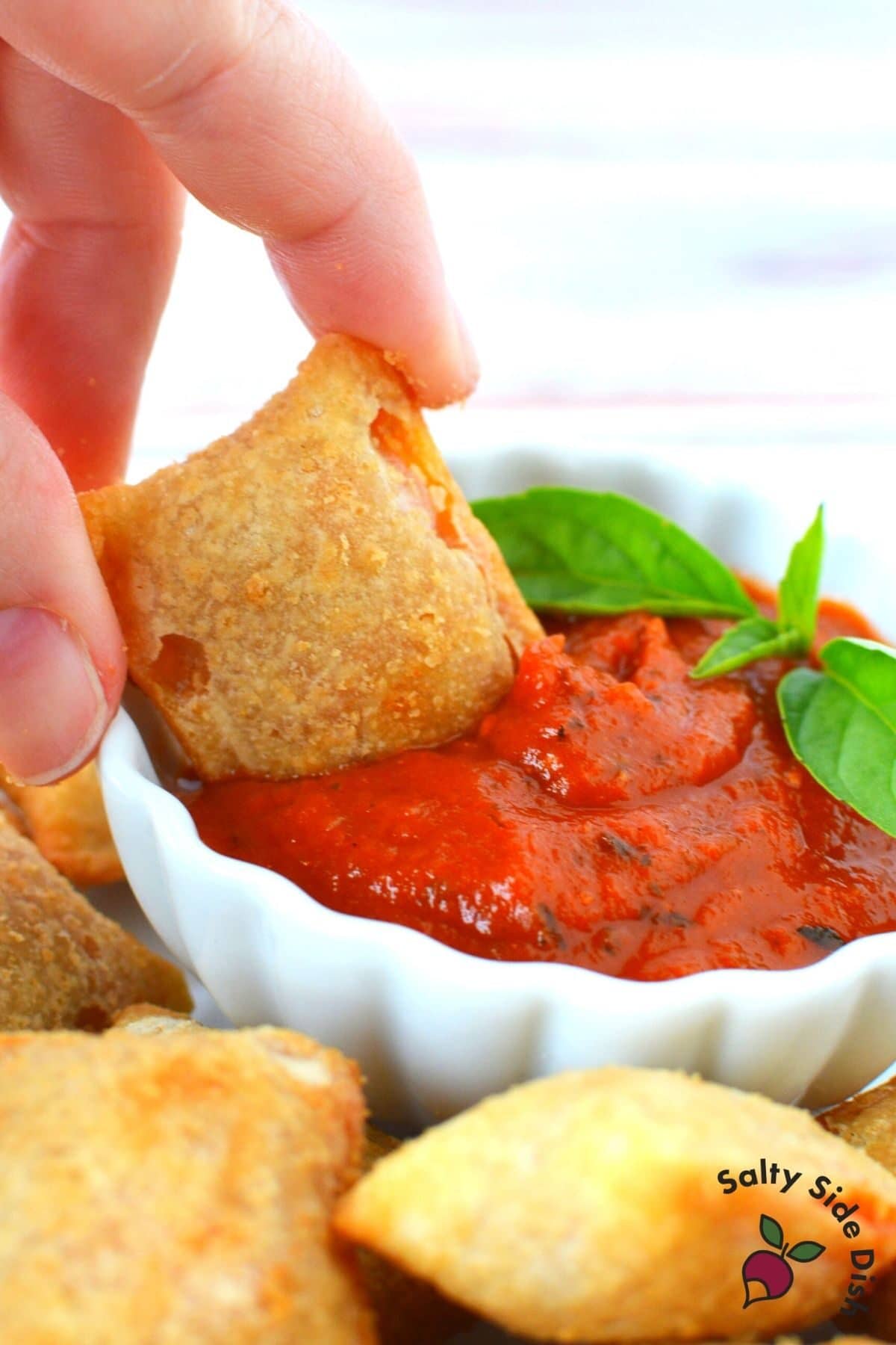 pizza roll in a dipping sauce
