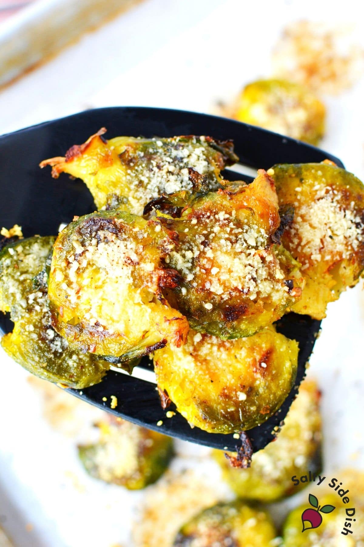 smashed brussels sprouts on a spatula