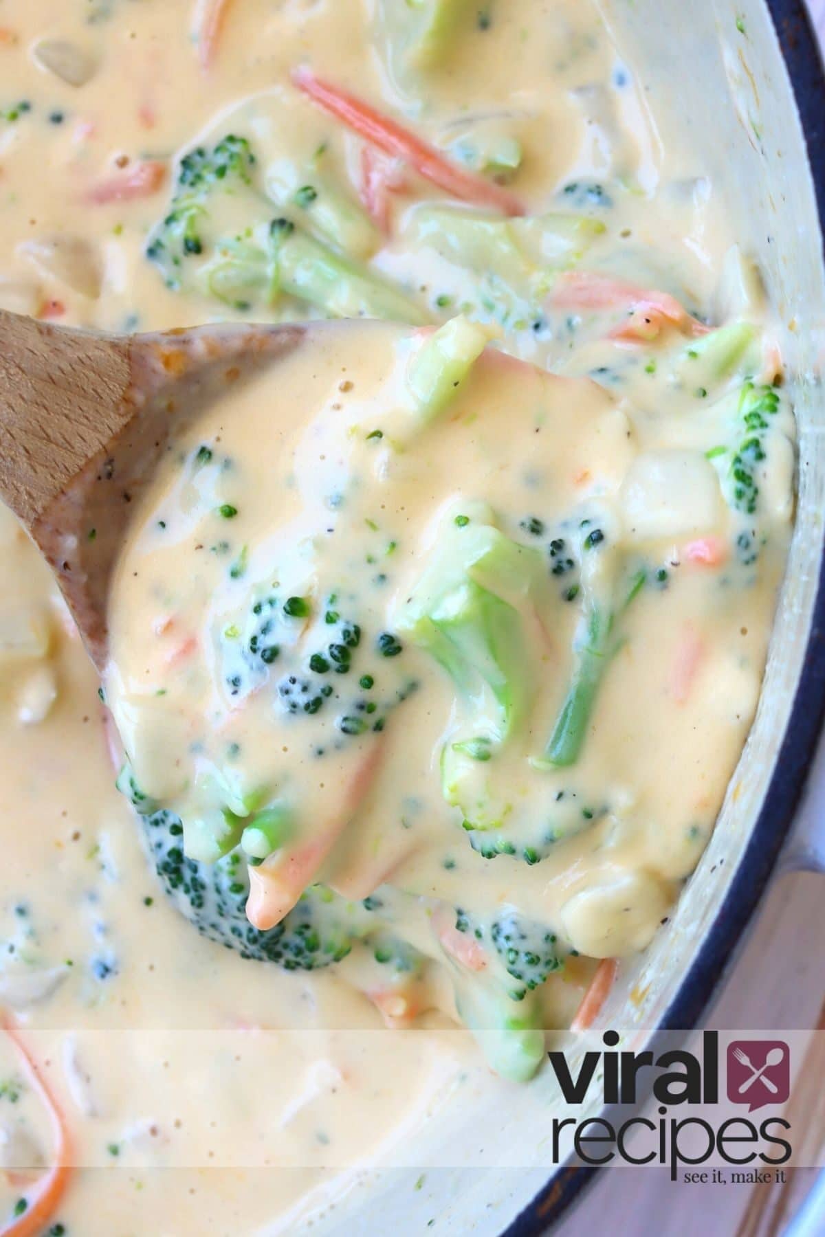 wooden spoon with broccoli cheese soup