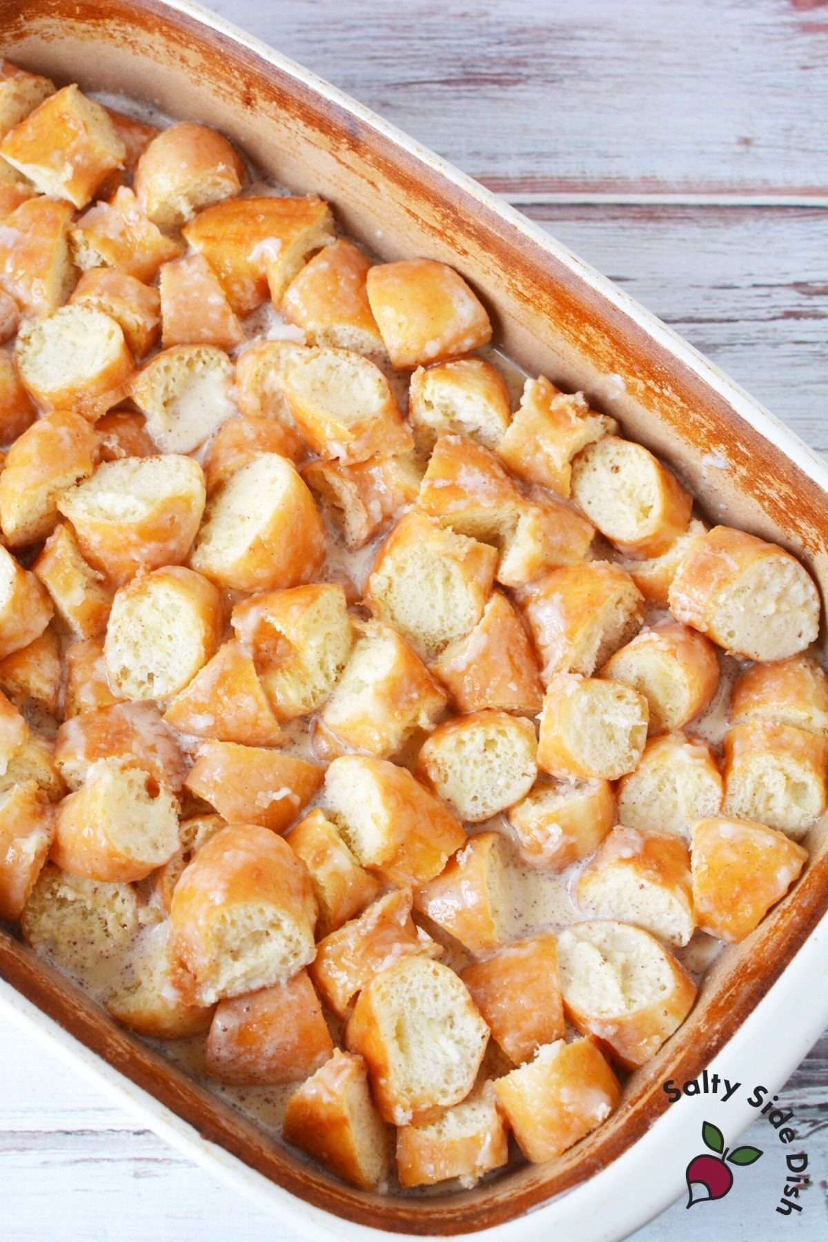 donuts in a casserole dish for bread pudding
