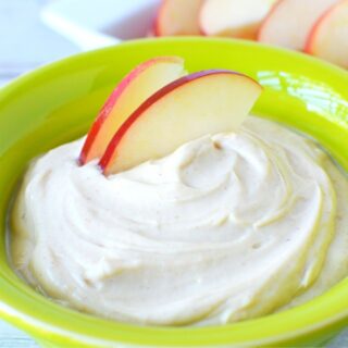apples dipped into peanut butter dip
