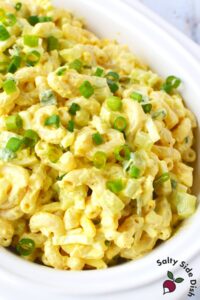 large white bowl of classic macaroni salad.