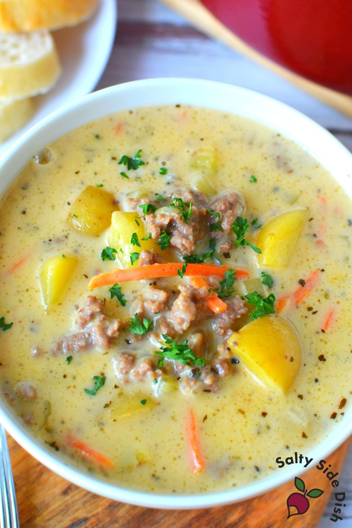 large white bowl of cheeseburger soup ready to serve.