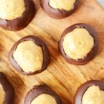 group of buckeye balls on a cutting board.